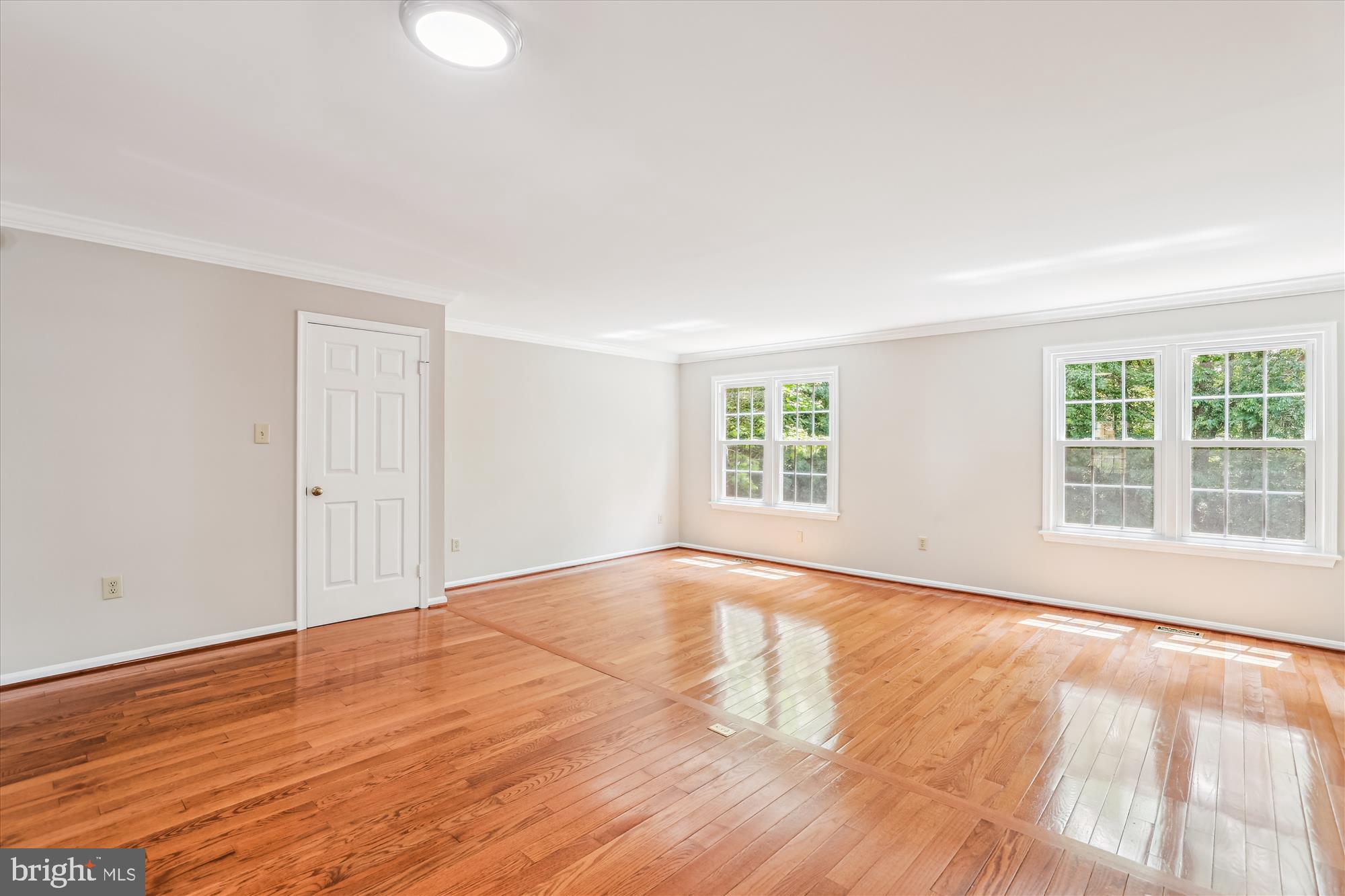 7708 Shootingstar Drive Springfield, VA 22152 - Photo 10 of 62 wooden floor in an empty room with a window