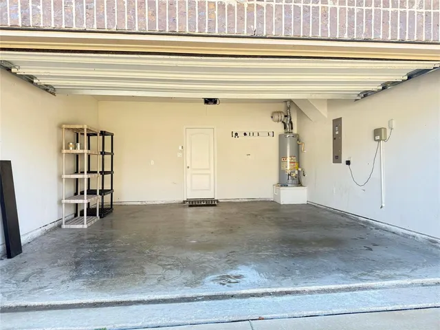 a view of a hallway with entryway and front door