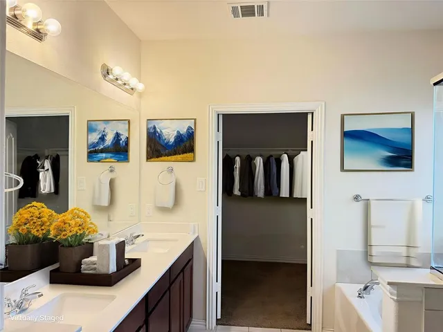 a kitchen with a sink and refrigerator