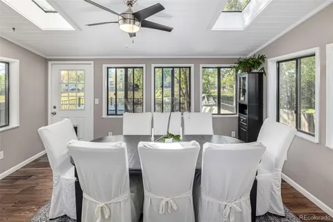 a dining room with furniture window wooden floor