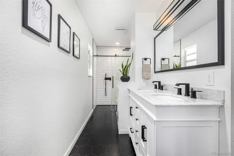 a bathroom with a sink a vanity and a mirror