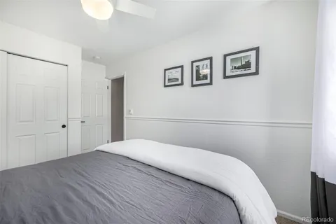 a bedroom with a bed and a view of bathroom