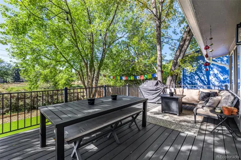 a view of a wooden deck with furniture