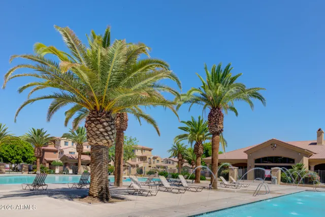 a view of a palm trees in front of a house