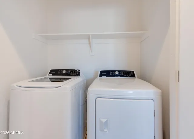 a utility room with dryer and washer