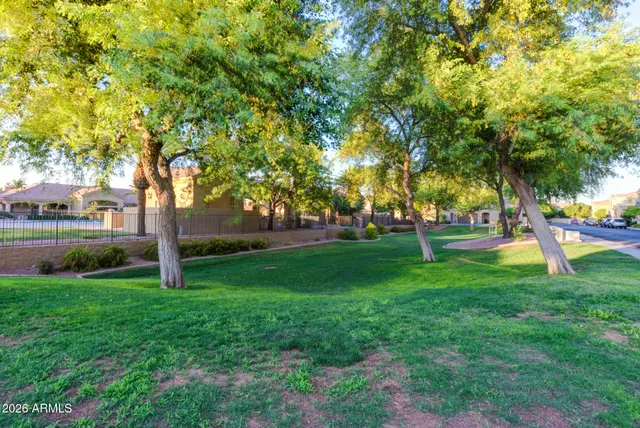 a view of outdoor space with garden and trees