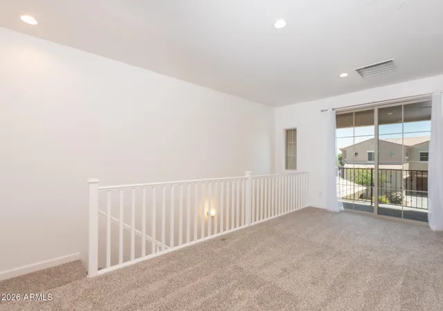 a view of a big room with windows