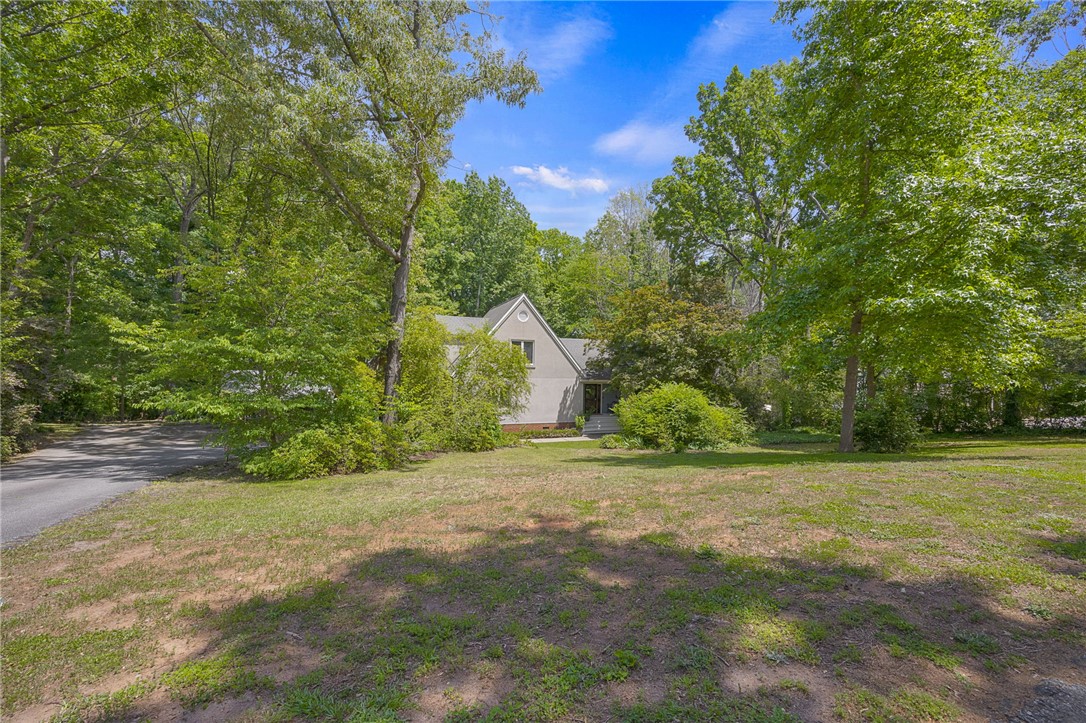 218 Northridge Drive Anderson, SC 29621 - Photo 47 of 50 A private, tree-lined approach leads to this charming home, nestled amidst mature greenery.