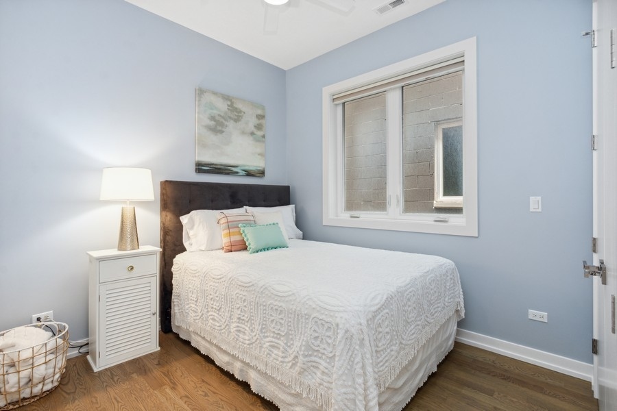 2437 West Haddon Avenue, Unit 2 Chicago, IL 60622 - Photo 12 of 14 a bedroom with a bed and window