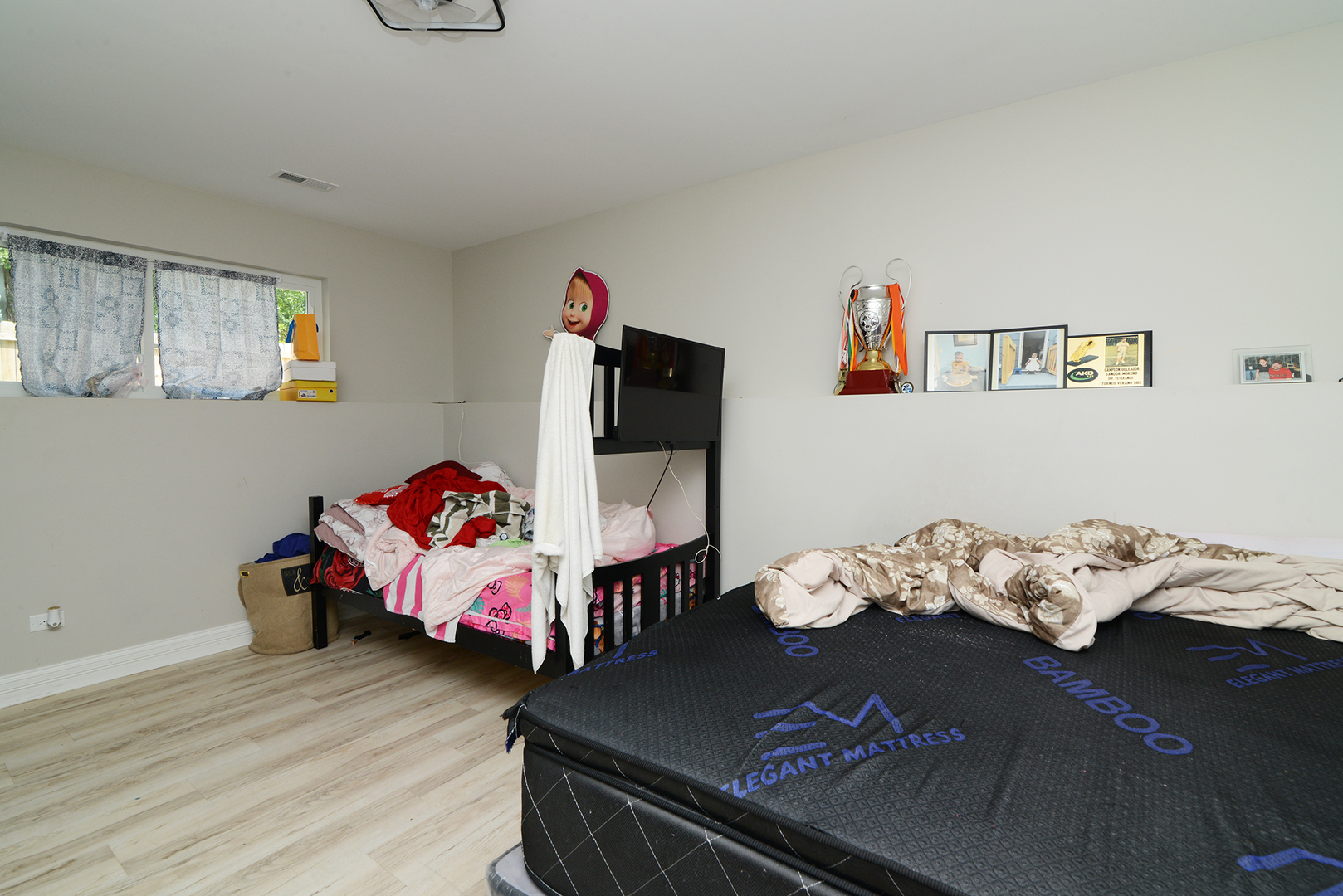 1051 North Springfield Avenue Chicago, IL 60651 - Photo 40 of 50 a bedroom with furniture and a book shelf
