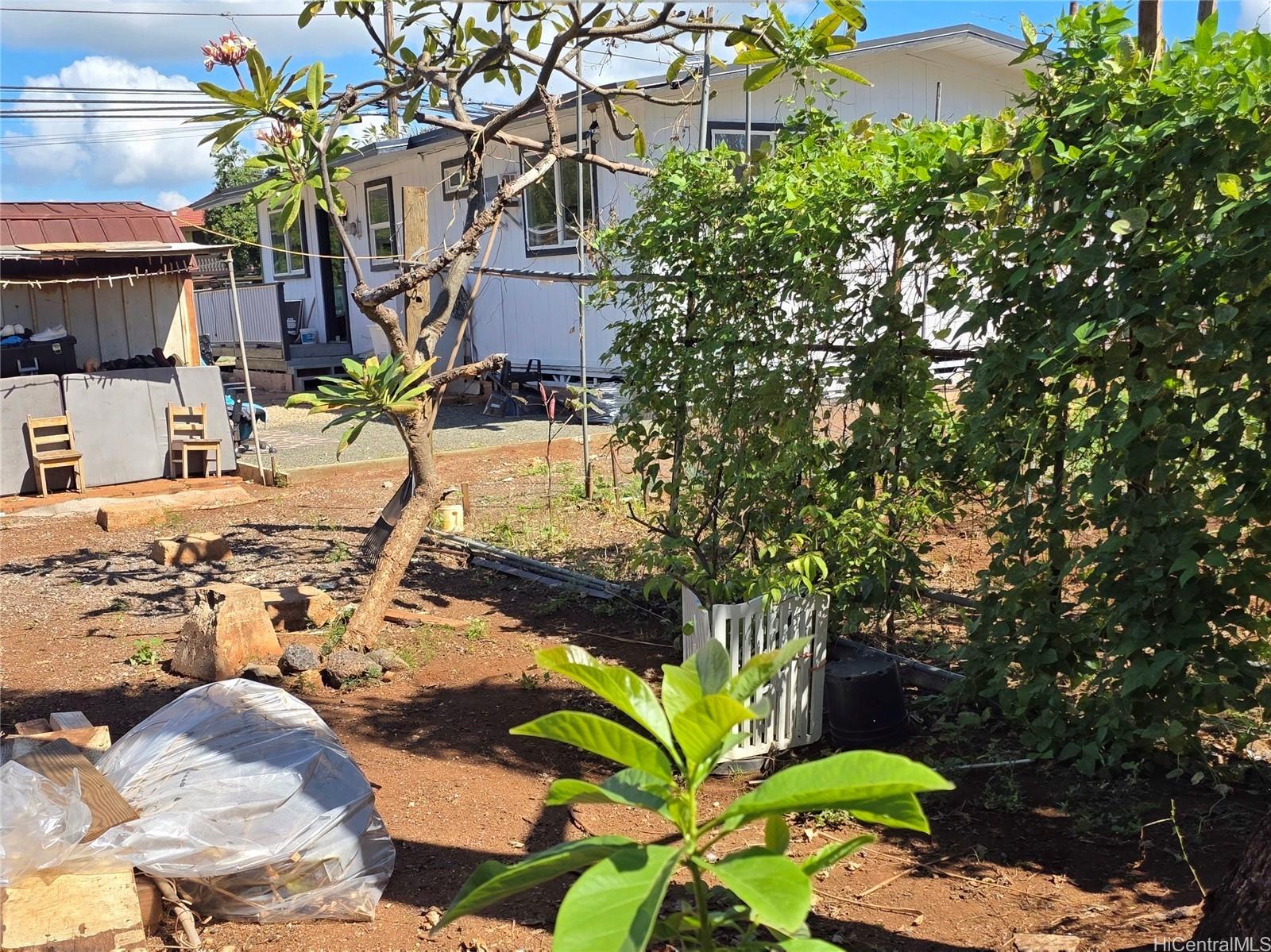 91-669 Pohakupuna Road Ewa Beach, HI 96706 - Photo 8 of 15 a view of yard and patio