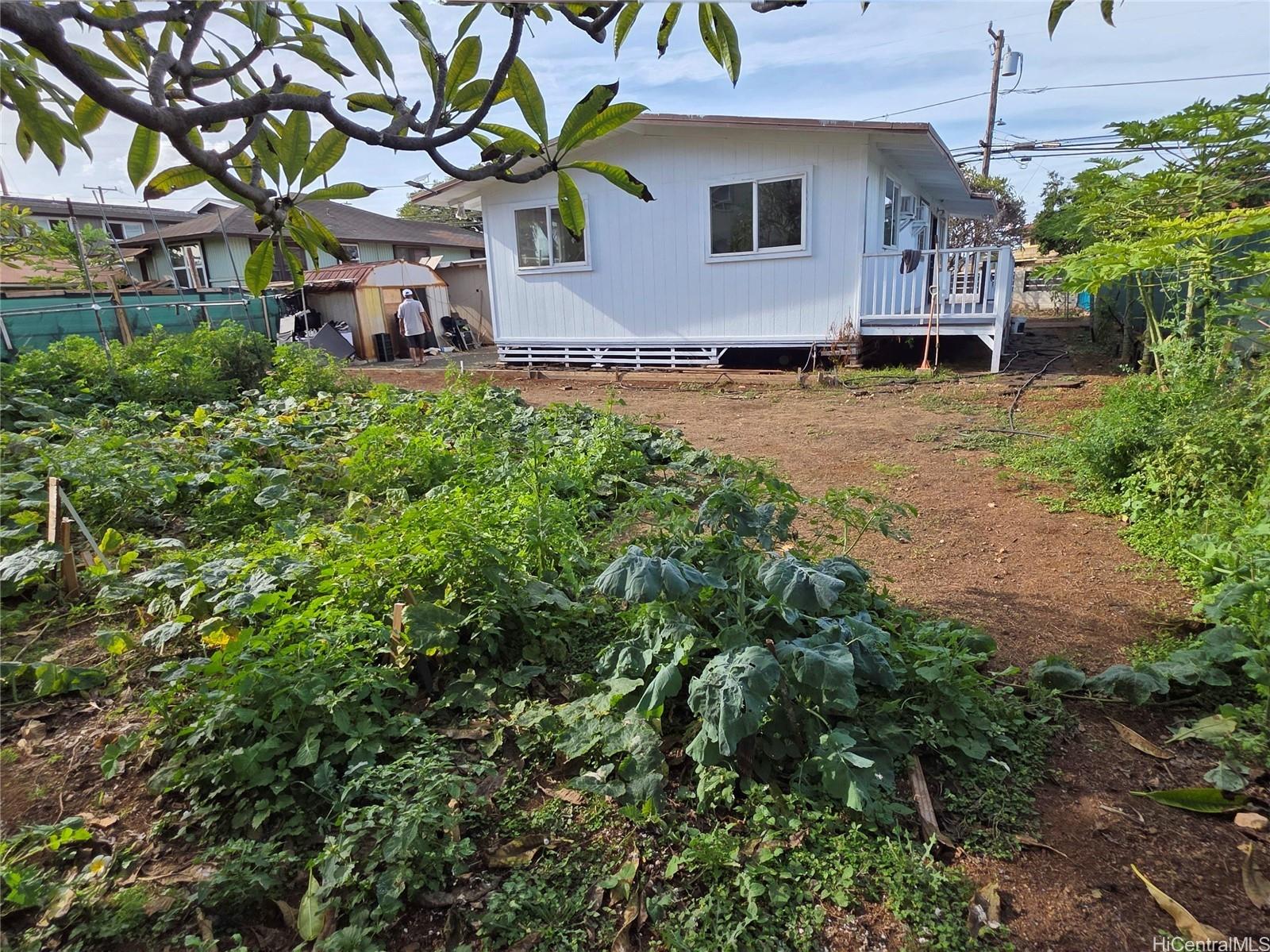 91-669 Pohakupuna Road Ewa Beach, HI 96706 - Photo 9 of 15 an aerial view of a house with a garden