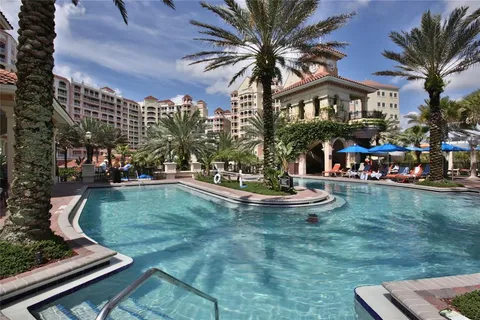 a view of a swimming pool with a table and chairs