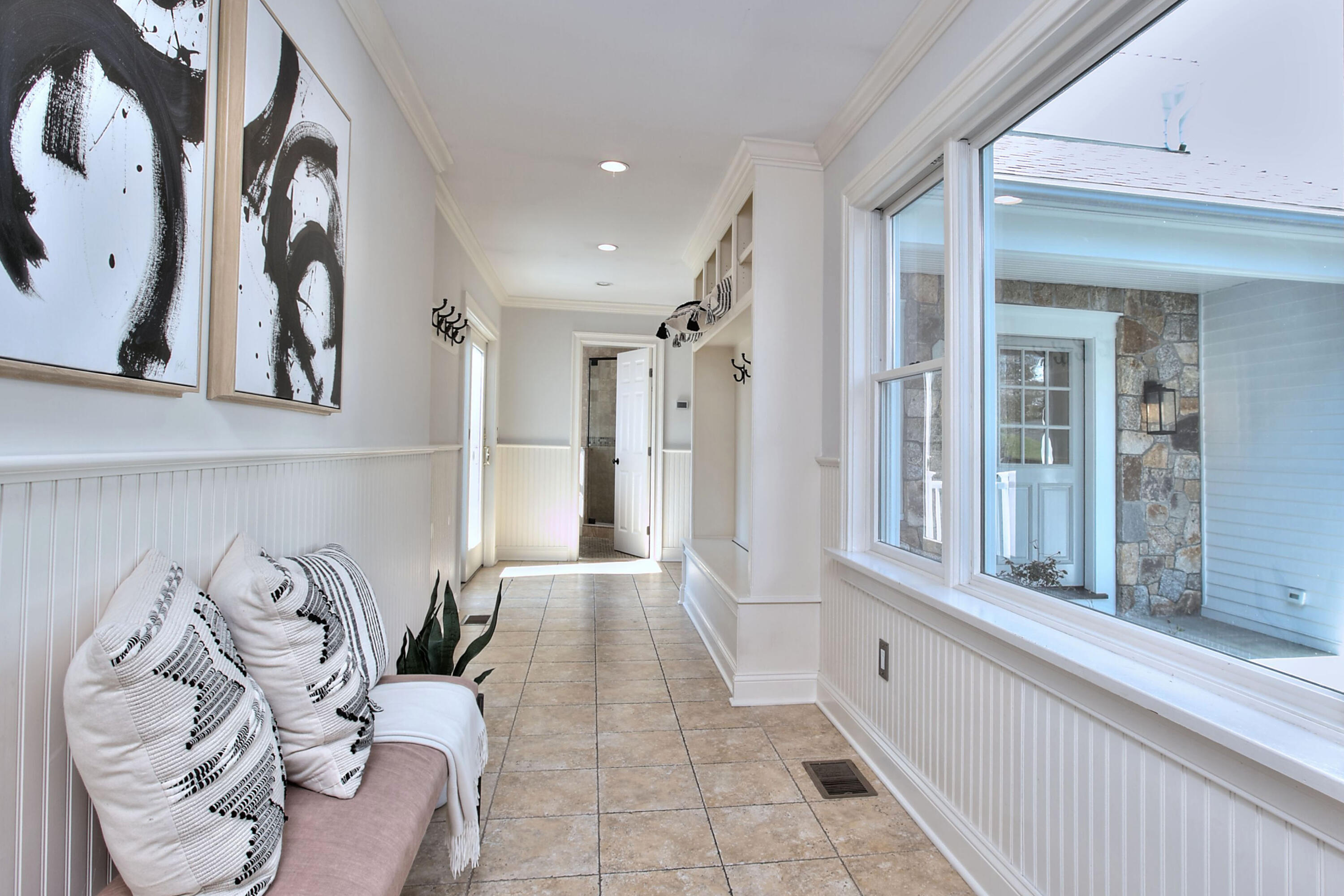 970 Ponus Ridge Road New Canaan, CT 06840 - Photo 16 of 39 a view of a entryway with furniture and floor to ceiling window