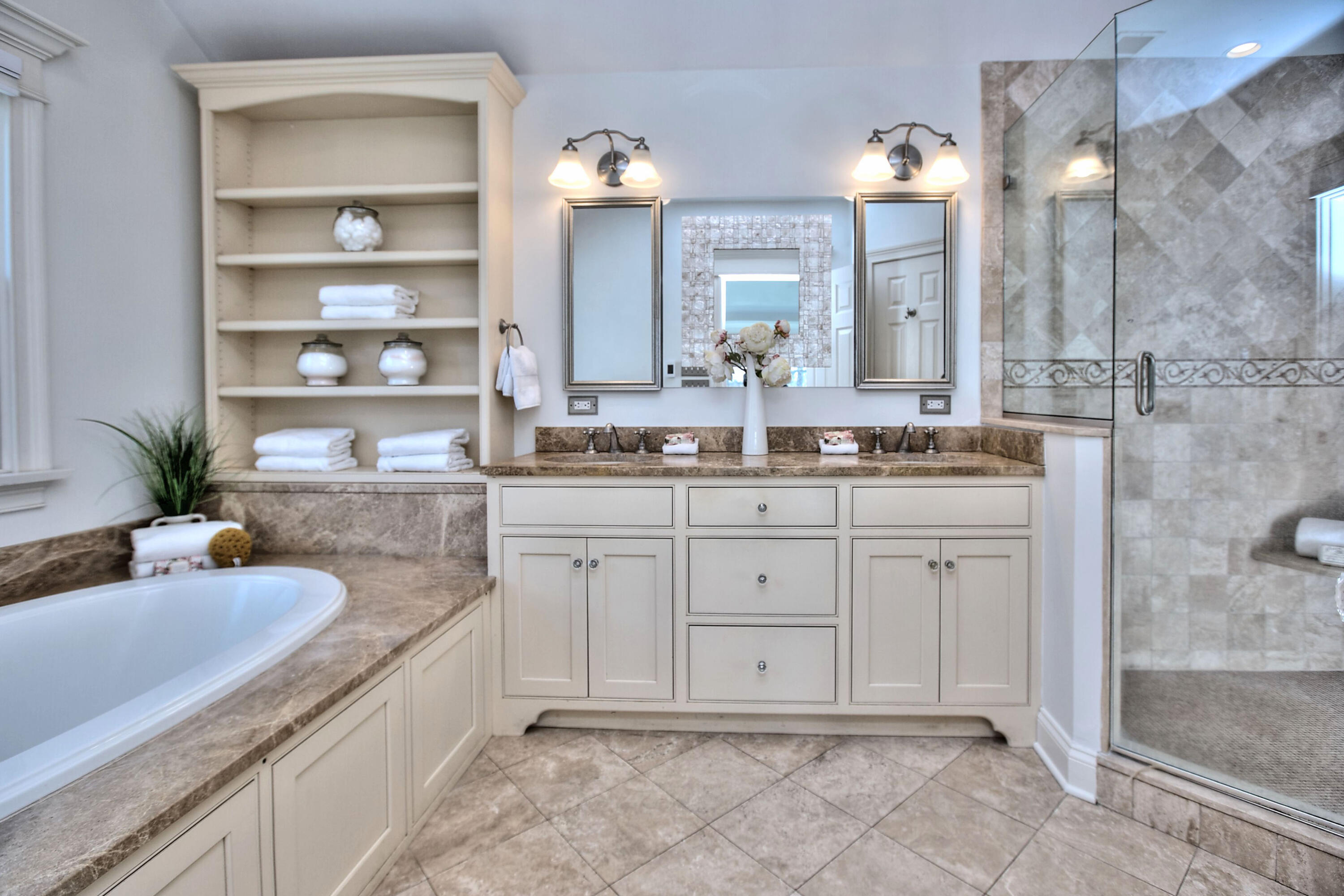 970 Ponus Ridge Road New Canaan, CT 06840 - Photo 19 of 39 a spacious bathroom with a granite countertop sink a mirror and a