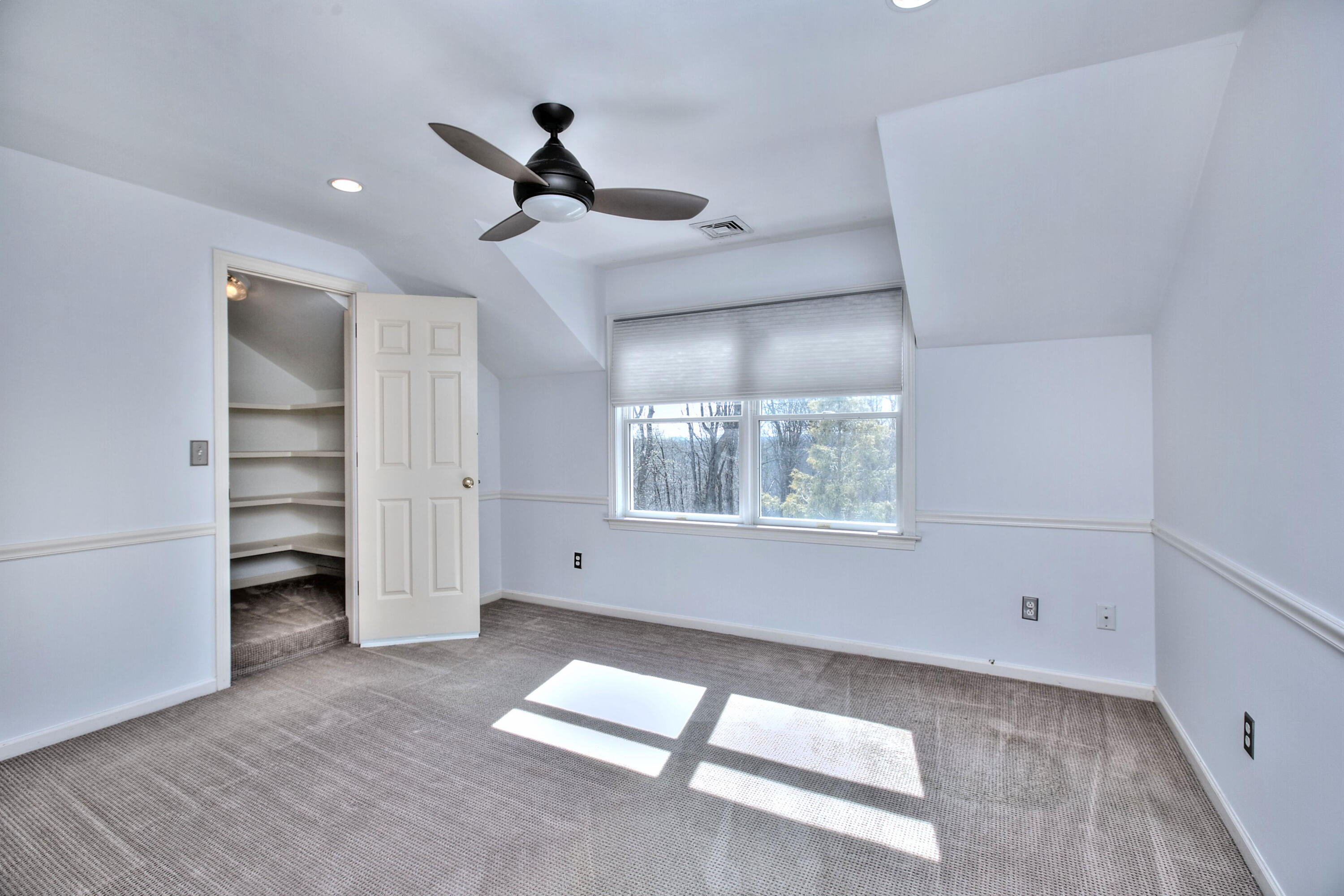 970 Ponus Ridge Road New Canaan, CT 06840 - Photo 23 of 39 a view of an empty room with a window