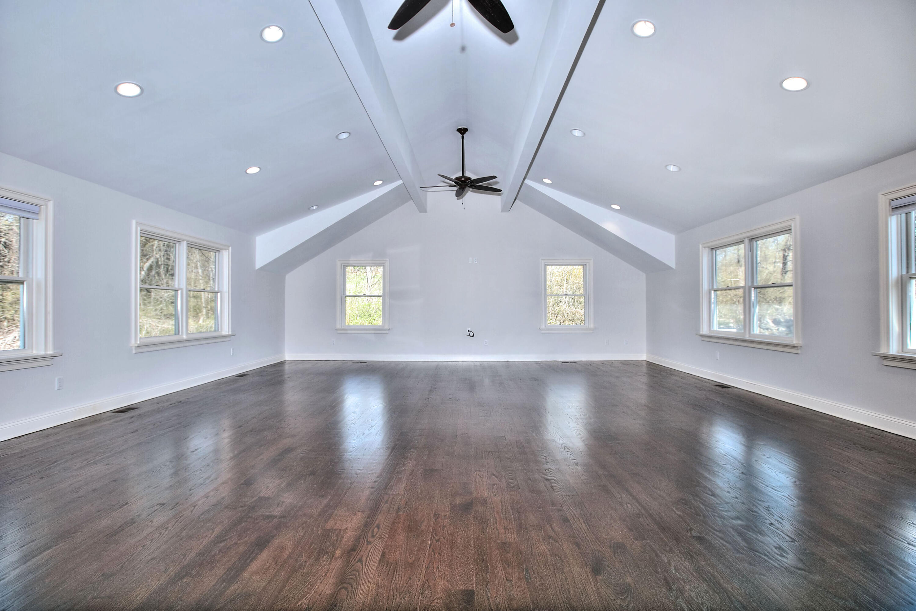 970 Ponus Ridge Road New Canaan, CT 06840 - Photo 27 of 39 an empty room with wooden floor and windows