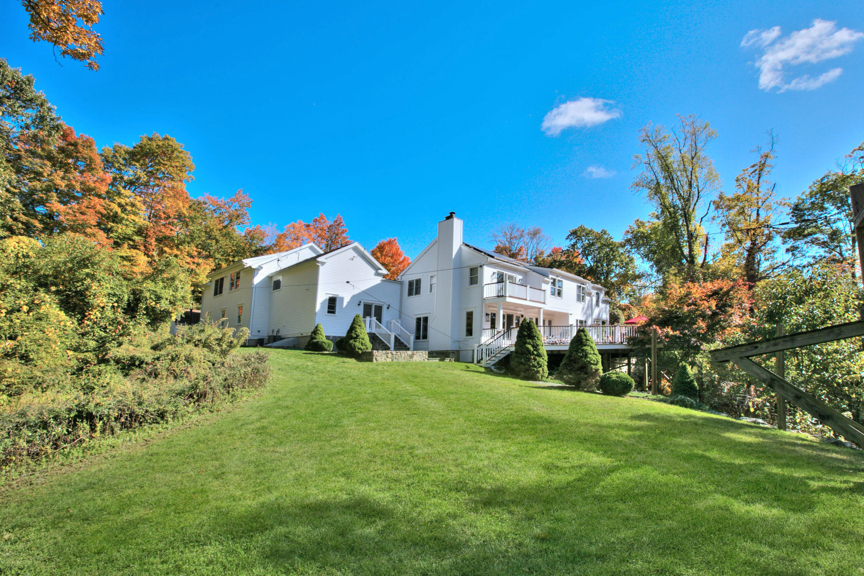 970 Ponus Ridge Road New Canaan, CT 06840 - Photo 35 of 39 a front view of a house with a yard