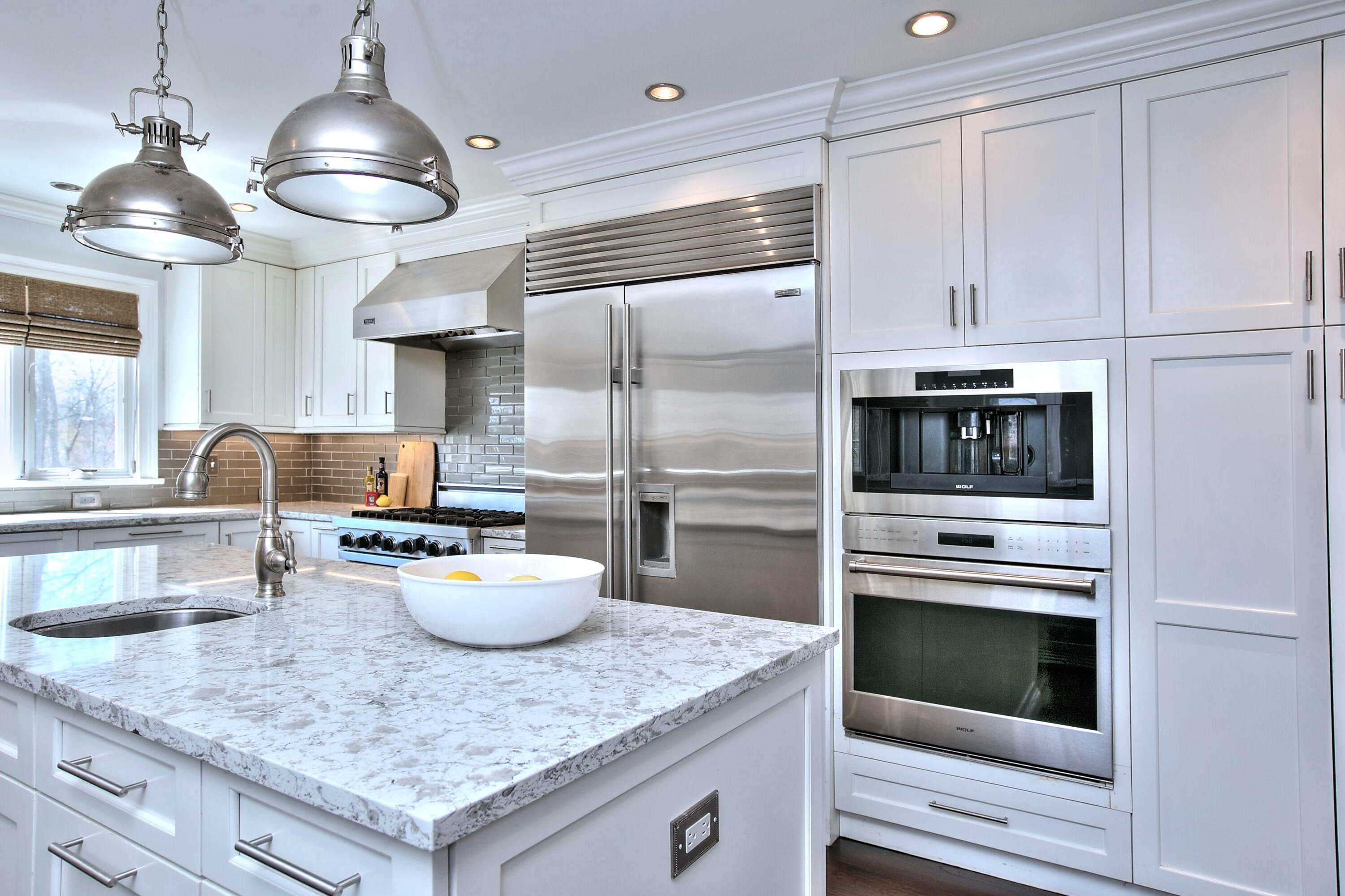 970 Ponus Ridge Road New Canaan, CT 06840 - Photo 6 of 39 a kitchen with a sink dishwasher a stove and a refrigerator with wooden floor