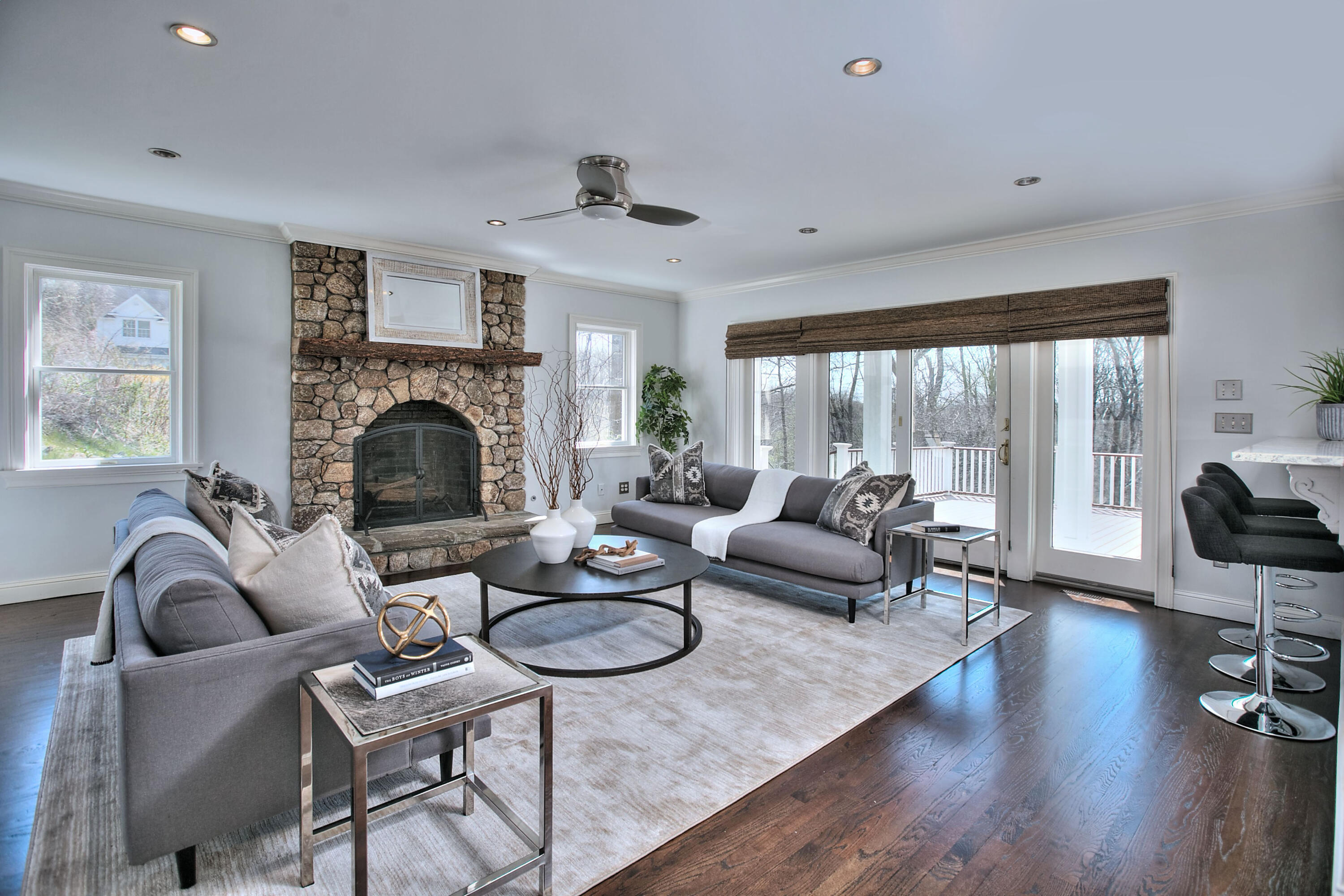 970 Ponus Ridge Road New Canaan, CT 06840 - Photo 9 of 39 a living room with furniture fireplace and a large window