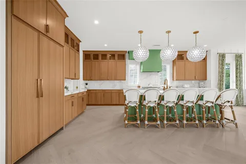 a bedroom with a bed and a flat tv screen on dresser