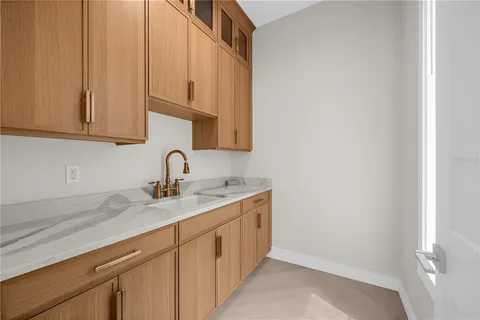 a bedroom with a bed and a mirror