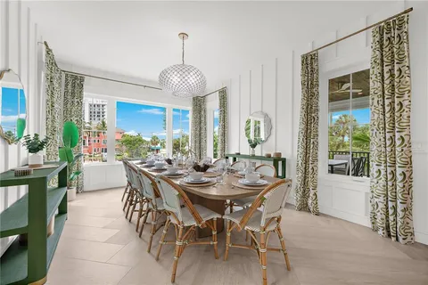 a bedroom with a bed and a flat tv screen on dresser