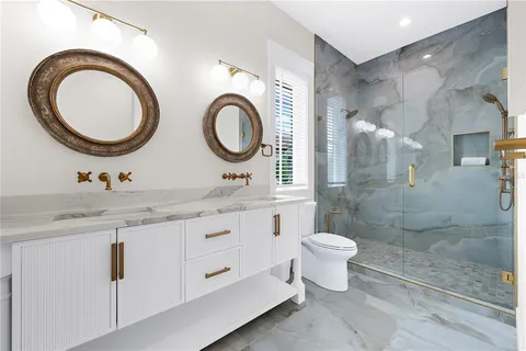 a view of a two chairs in the balcony