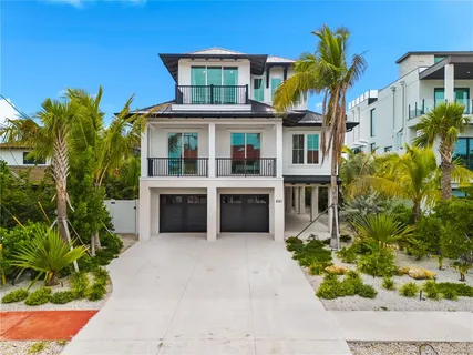 a kitchen with stainless steel appliances granite countertop a sink and a stove