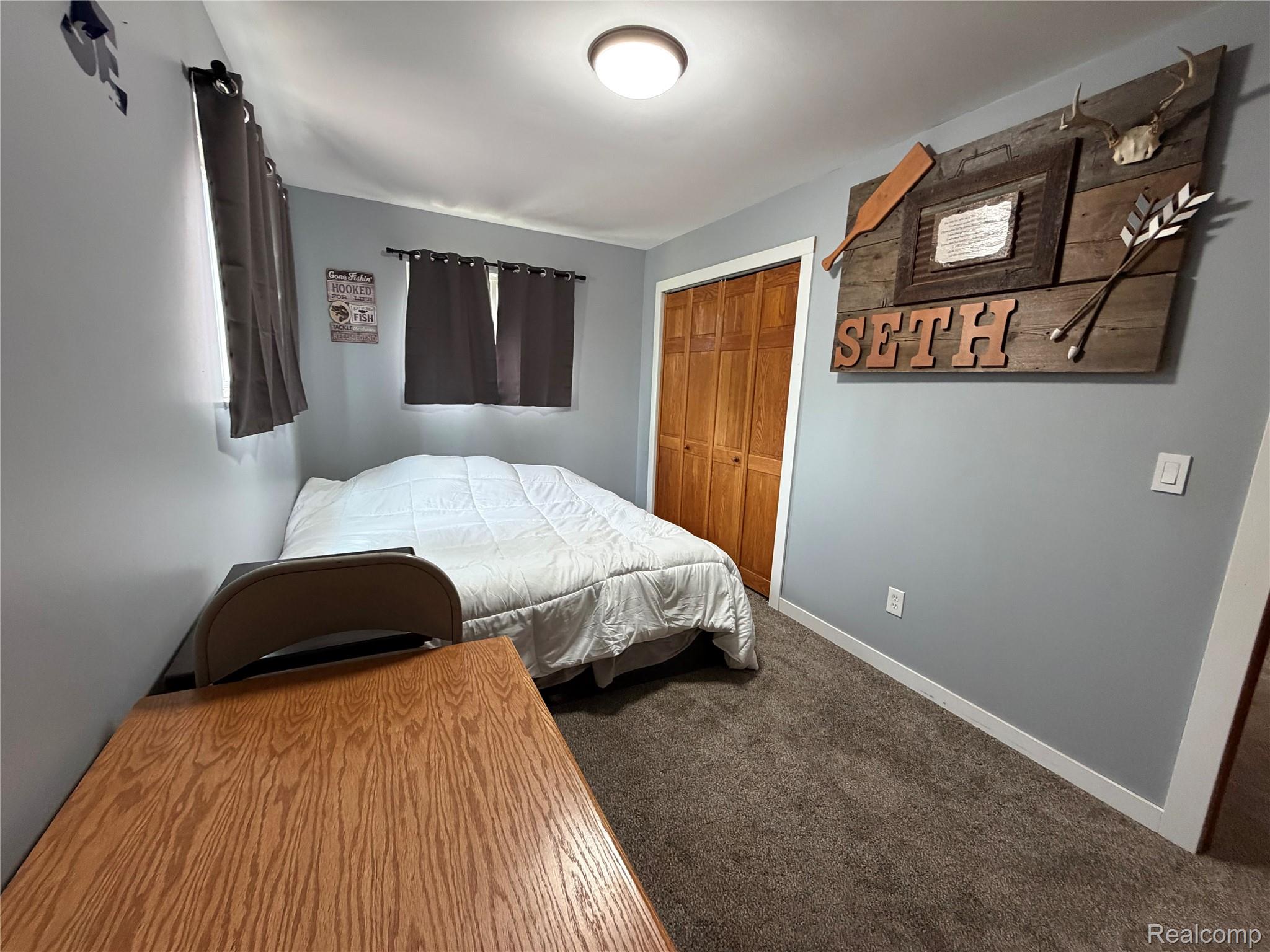 2712 North Branch Road North Branch, MI 48461 - Photo 24 of 37 Bedroom with dark colored carpet and a closet