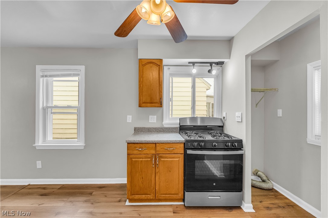18517 Homeway Road Cleveland, OH 44135 - Photo 13 of 29 Compact kitchen area featuring wood-finish flooring and light gray walls