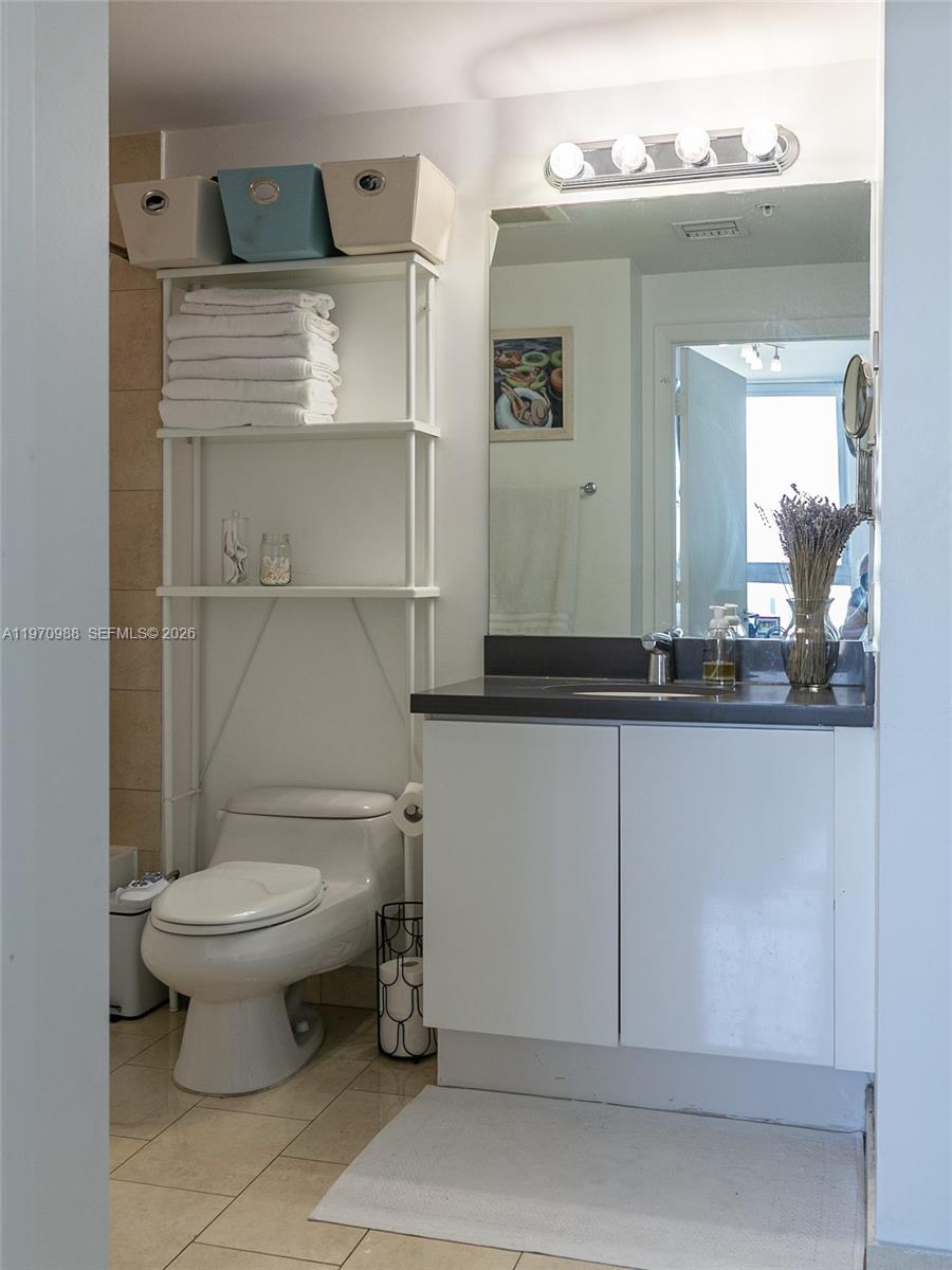 90 Southwest 3rd Street, Unit 1611 Miami, FL 33130 - Photo 18 of 44 a bathroom with a toilet and a sink
