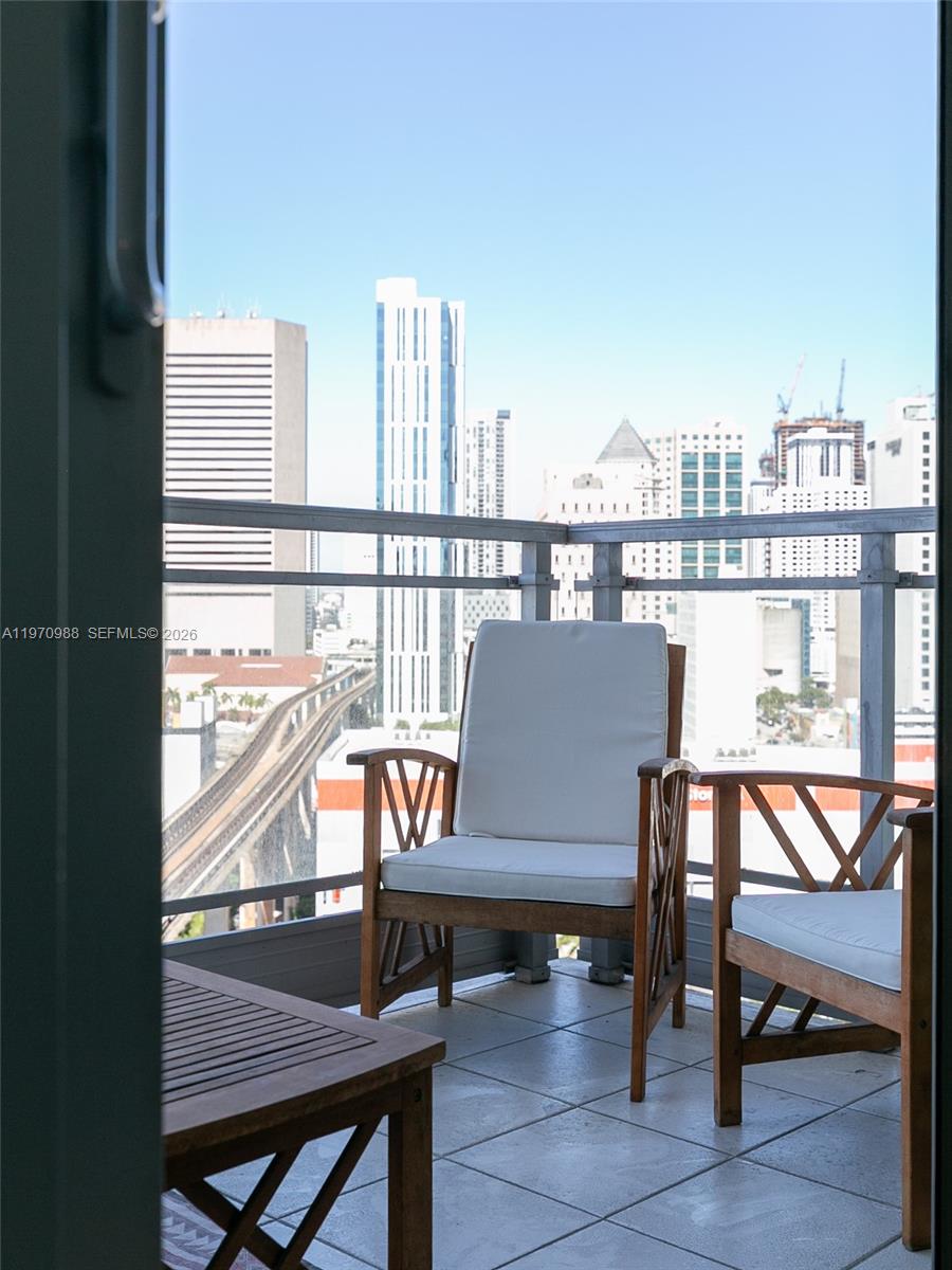 90 Southwest 3rd Street, Unit 1611 Miami, FL 33130 - Photo 22 of 44 a view of a balcony with chairs