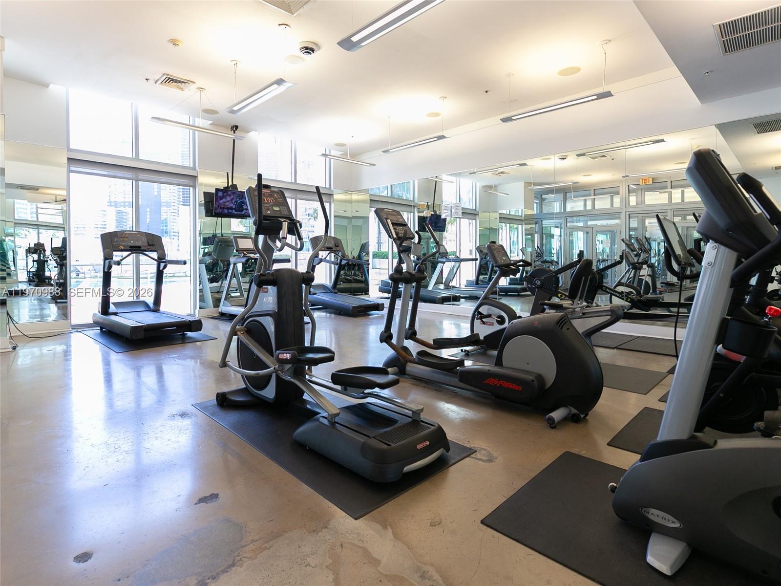 90 Southwest 3rd Street, Unit 1611 Miami, FL 33130 - Photo 23 of 44 a view of a room with gym equipment