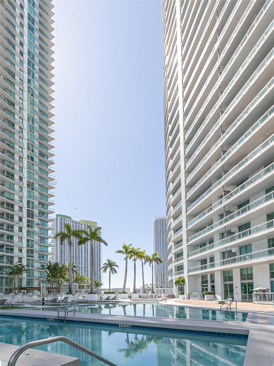 90 Southwest 3rd Street, Unit 1611 Miami, FL 33130 - Photo 27 of 44 a view of a swimming pool with outdoor seating