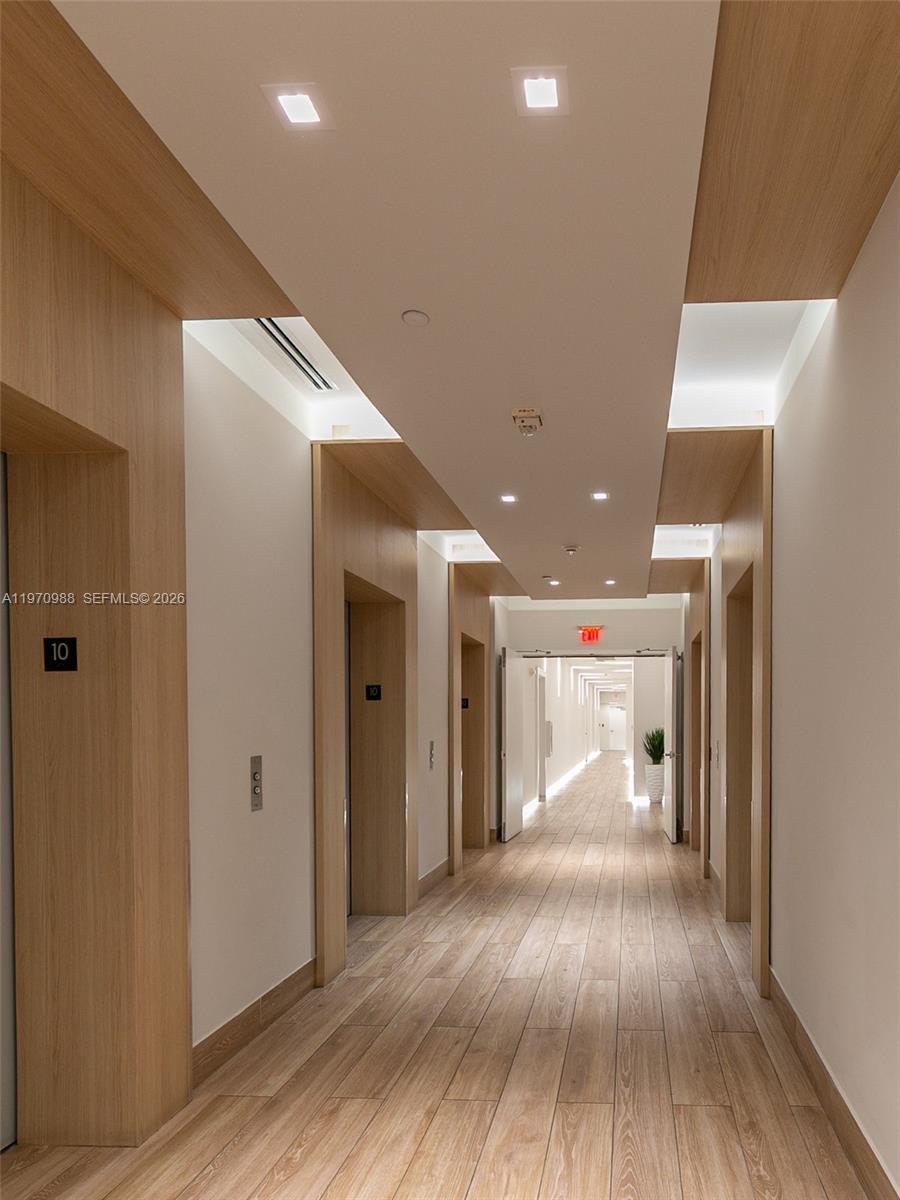 90 Southwest 3rd Street, Unit 1611 Miami, FL 33130 - Photo 29 of 44 a view of hallway with wooden floor