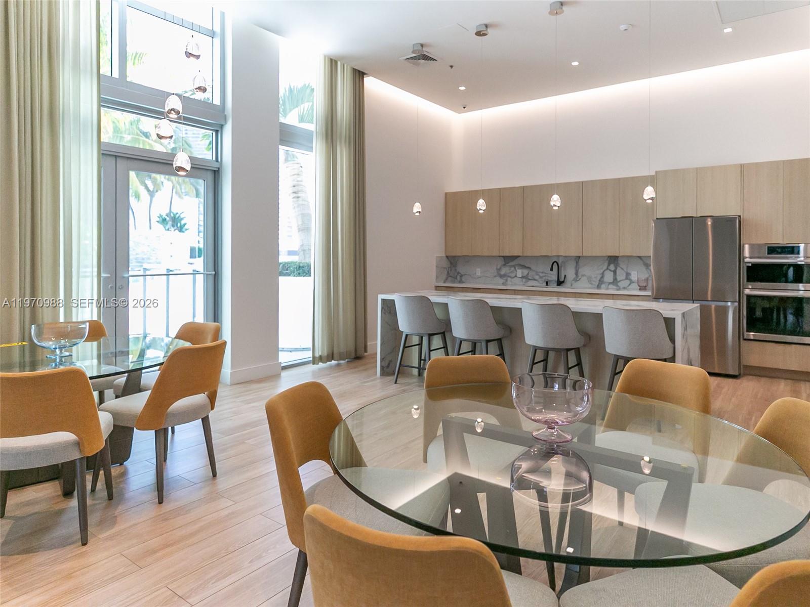 90 Southwest 3rd Street, Unit 1611 Miami, FL 33130 - Photo 38 of 44 a dining room with furniture a table and chairs