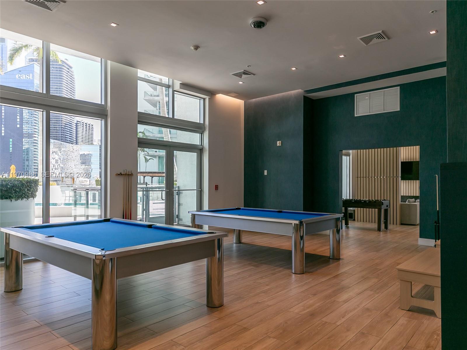 90 Southwest 3rd Street, Unit 1611 Miami, FL 33130 - Photo 40 of 44 a room with pool table and windows