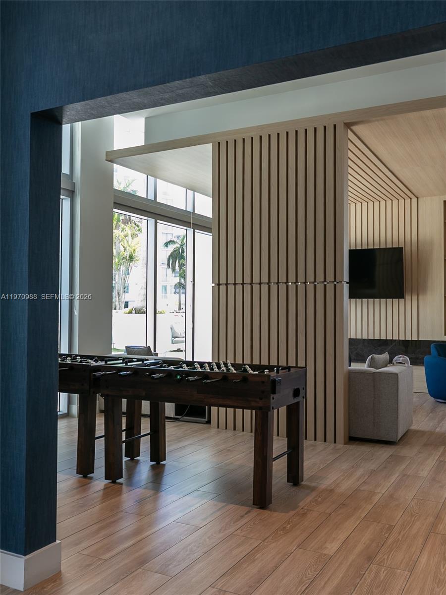 90 Southwest 3rd Street, Unit 1611 Miami, FL 33130 - Photo 41 of 44 a view of a room with furniture and wooden floor