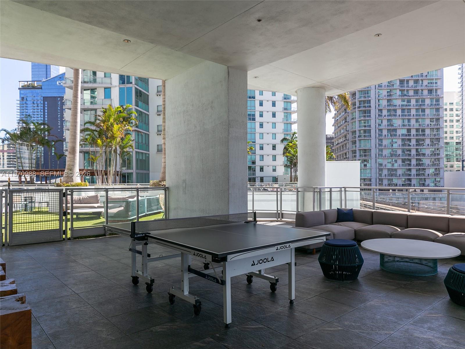 90 Southwest 3rd Street, Unit 1611 Miami, FL 33130 - Photo 42 of 44 a living room with furniture and wooden floor