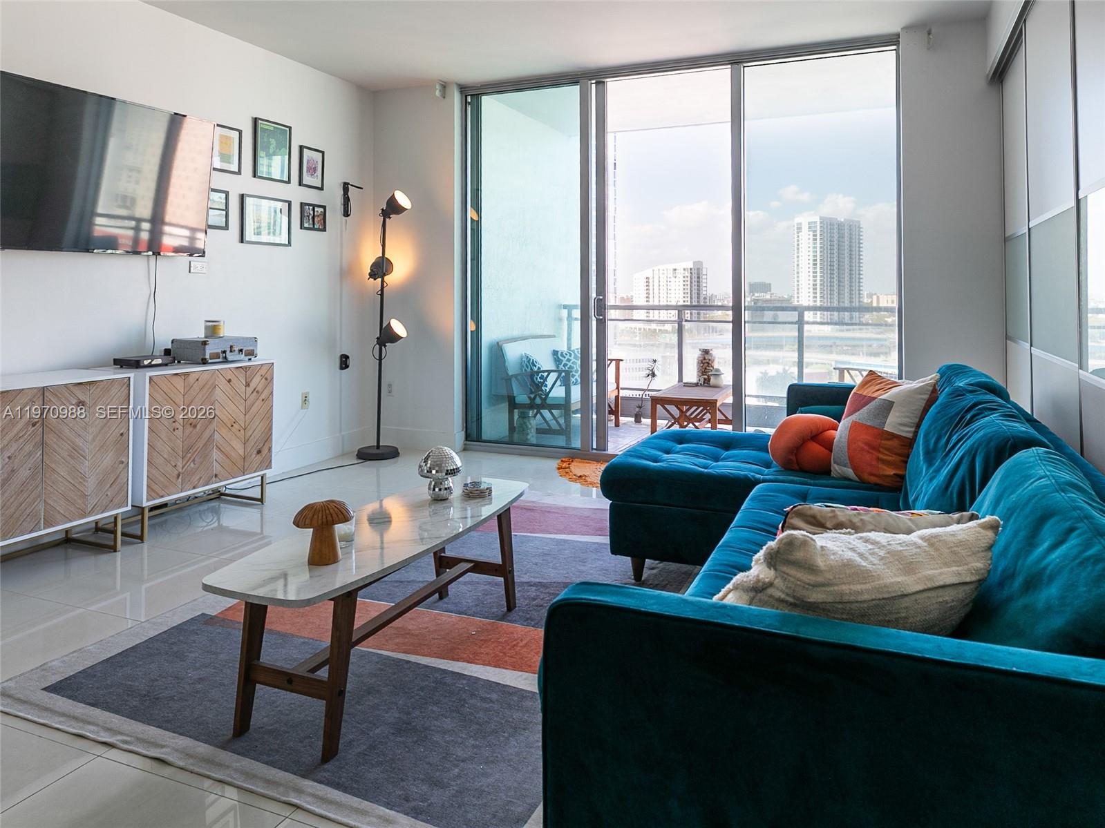 90 Southwest 3rd Street, Unit 1611 Miami, FL 33130 - Photo 9 of 44 a living room with furniture and a window