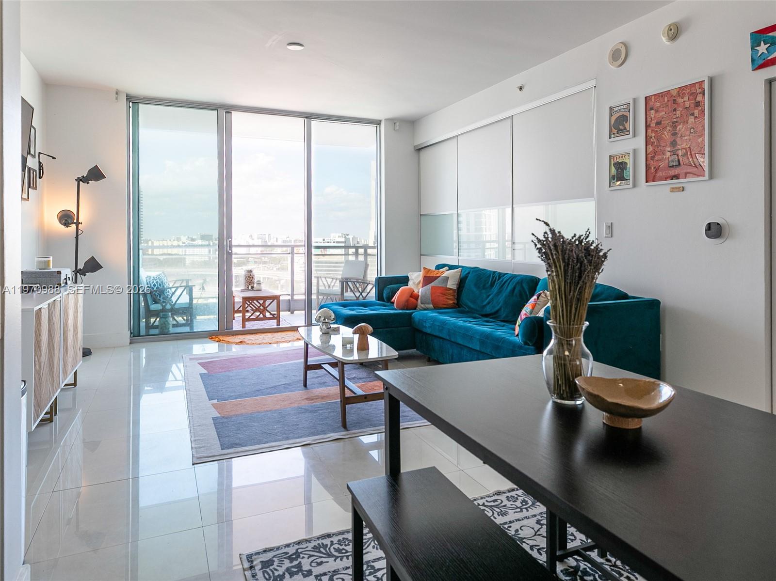 90 Southwest 3rd Street, Unit 1611 Miami, FL 33130 - Photo 10 of 44 a living room with furniture and a large window