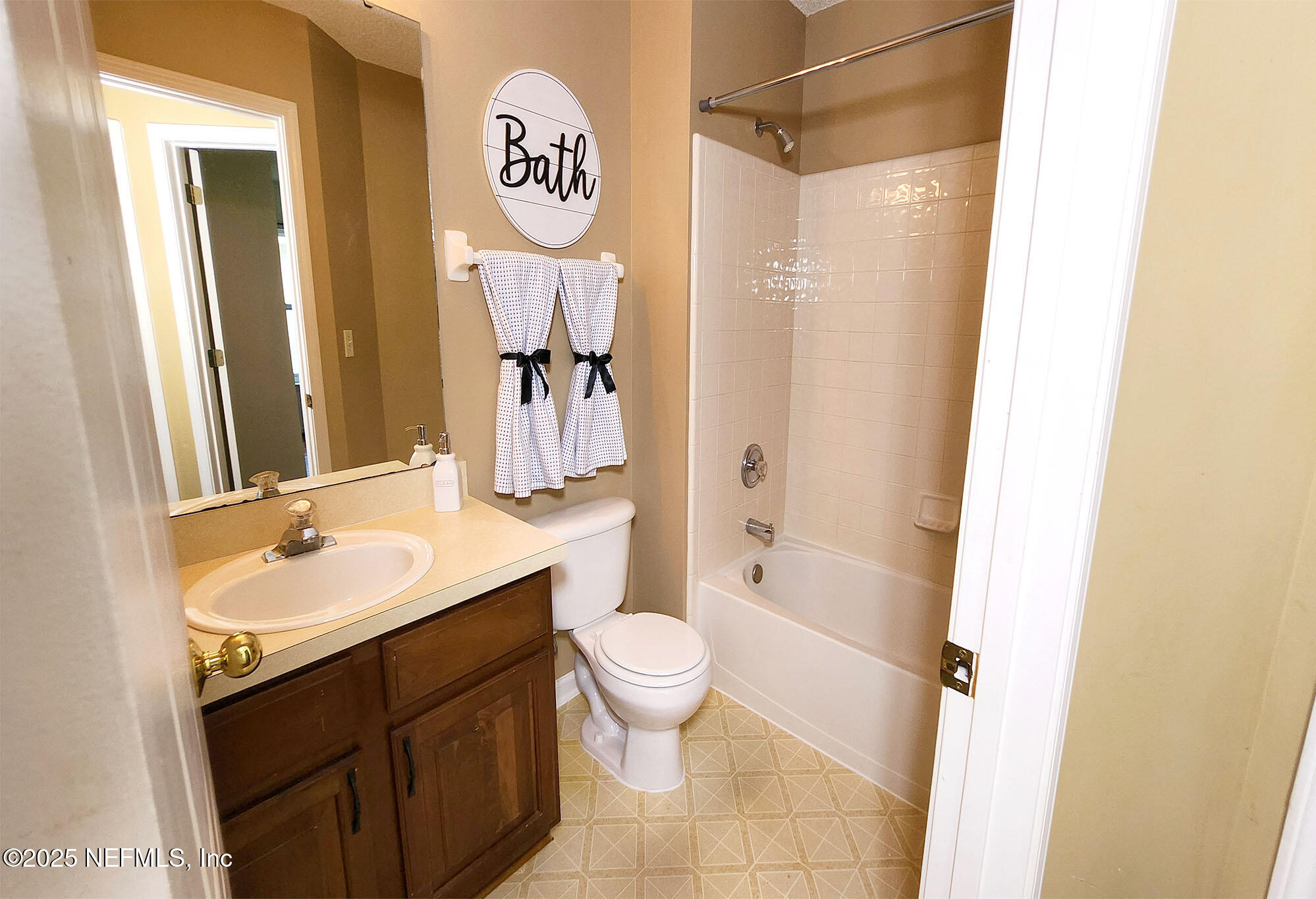 6257 Duclay Road Jacksonville, FL 32244 - Photo 15 of 21 a bathroom with a sink a toilet and shower