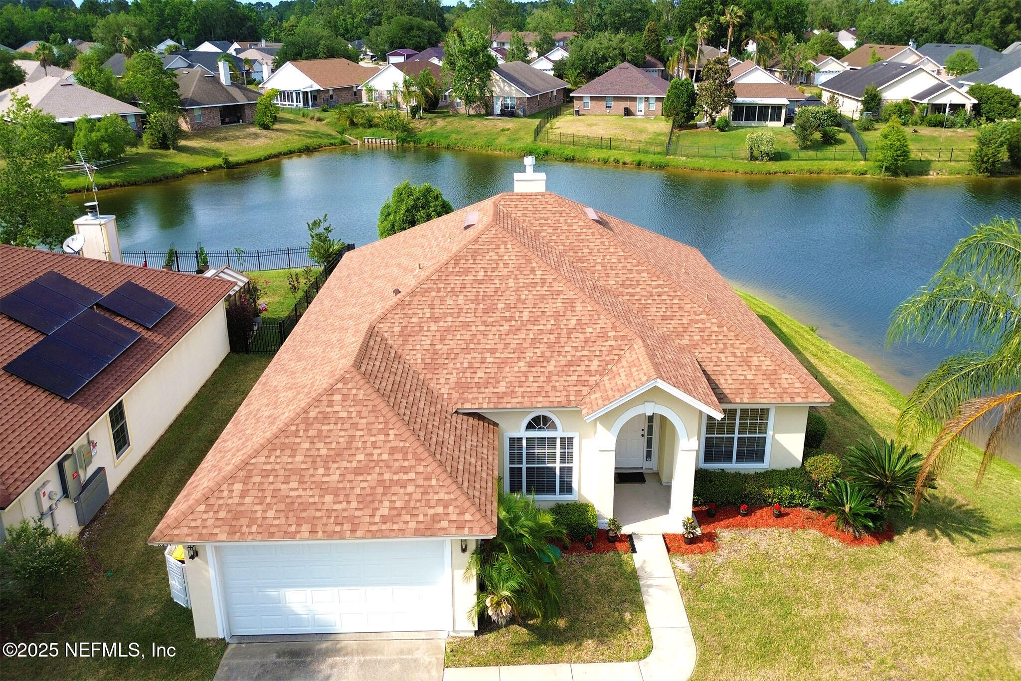 6257 Duclay Road Jacksonville, FL 32244 - Photo 2 of 21 an aerial view of a house with a lake view