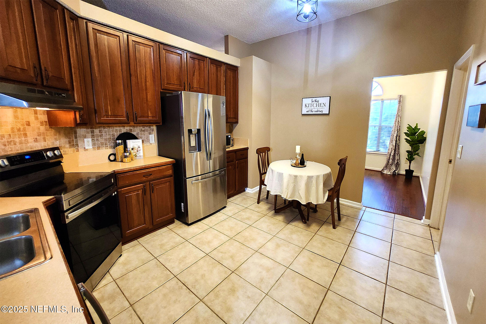 6257 Duclay Road Jacksonville, FL 32244 - Photo 6 of 21 a kitchen with a sink cabinets and appliances