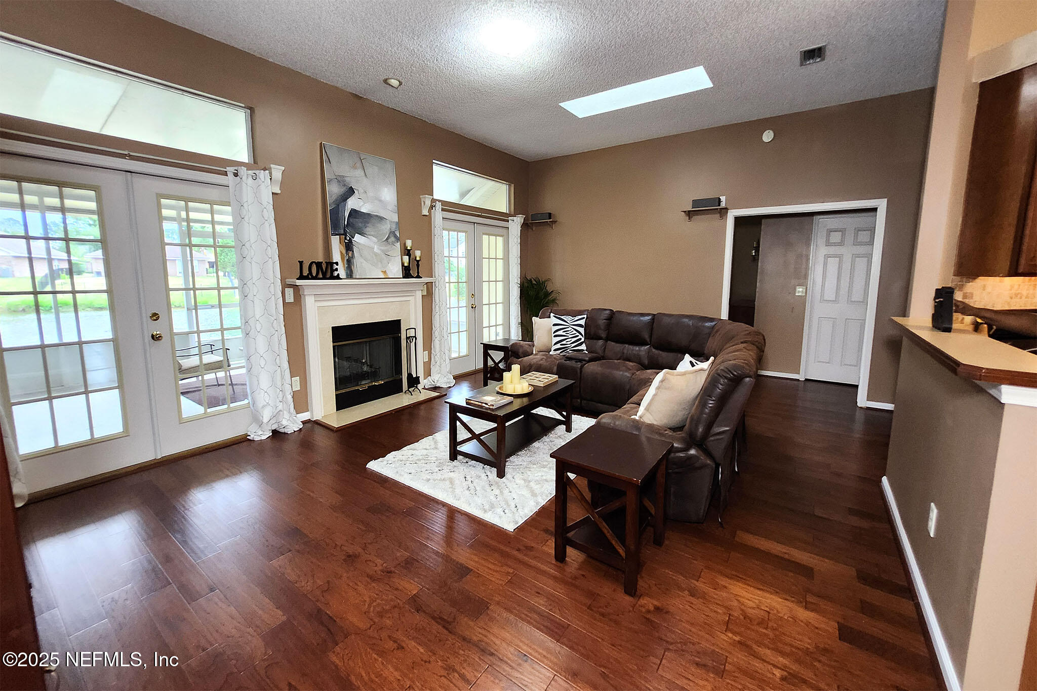 6257 Duclay Road Jacksonville, FL 32244 - Photo 8 of 21 a living room with fireplace furniture and a wooden floor