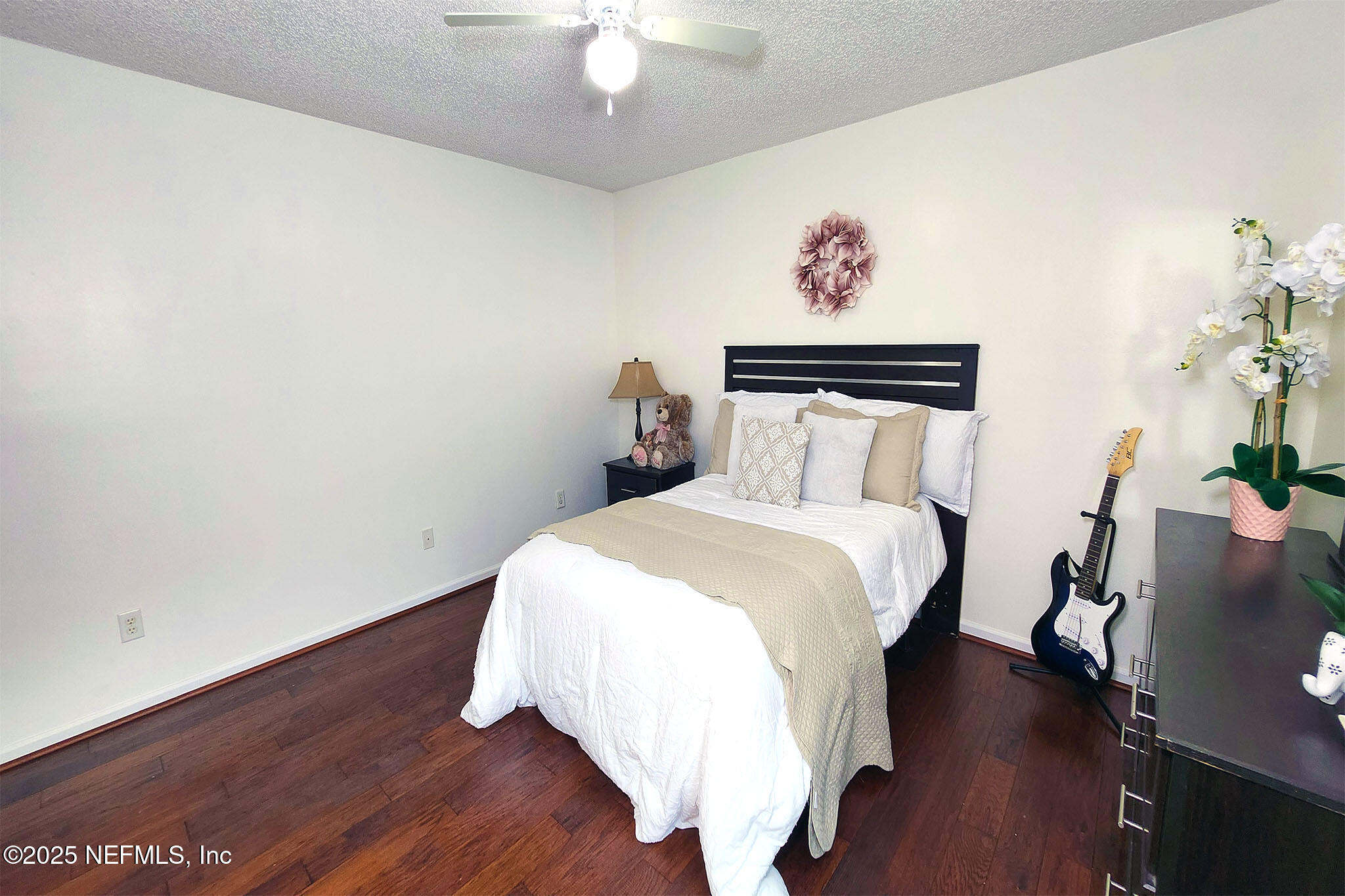 6257 Duclay Road Jacksonville, FL 32244 - Photo 10 of 21 a bedroom with a bed and wooden floor