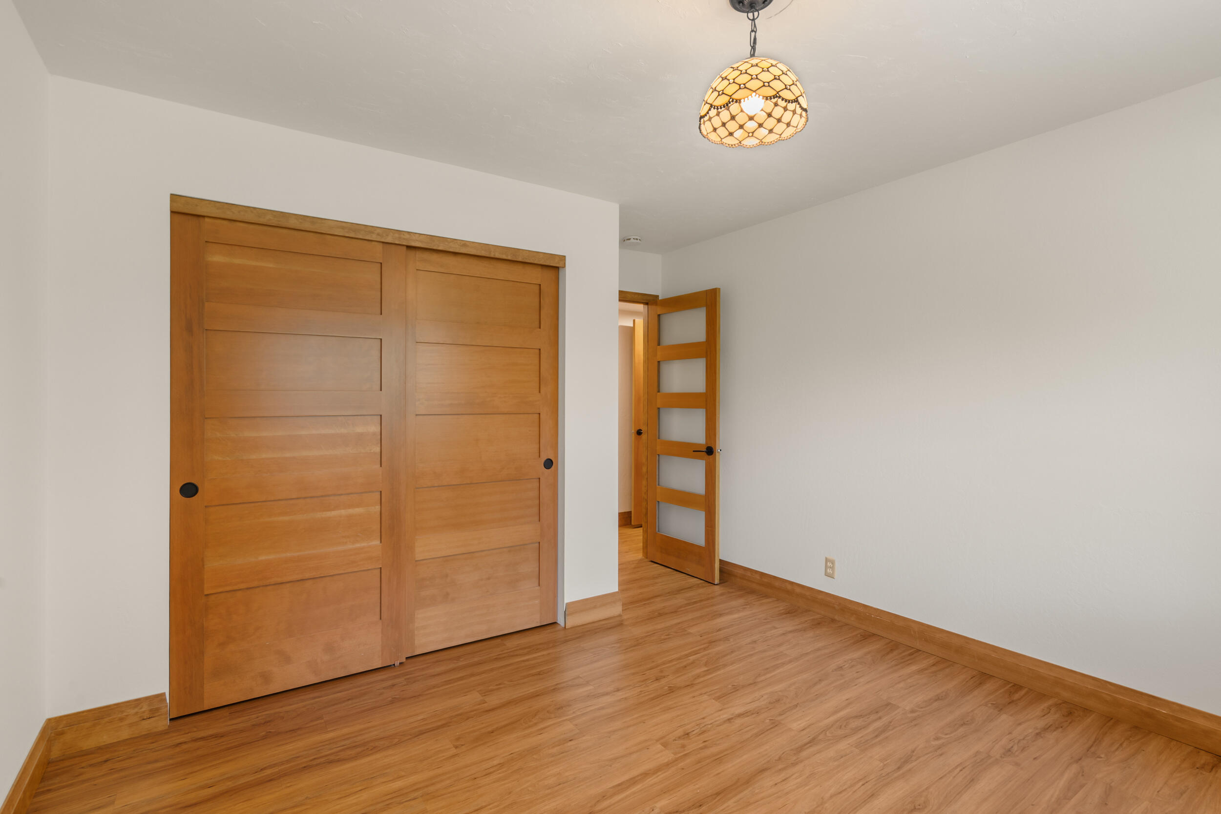 3583 Ross Lane Central Point, OR 97502 - Photo 20 of 52 an empty room with wooden floor closet and windows