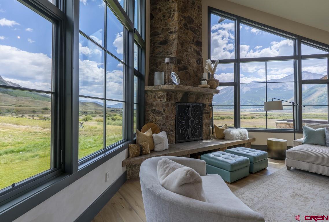 7 Moon Ridge Lane Crested Butte, CO 81224 - Photo 16 of 44 a living room with furniture and a floor to ceiling window