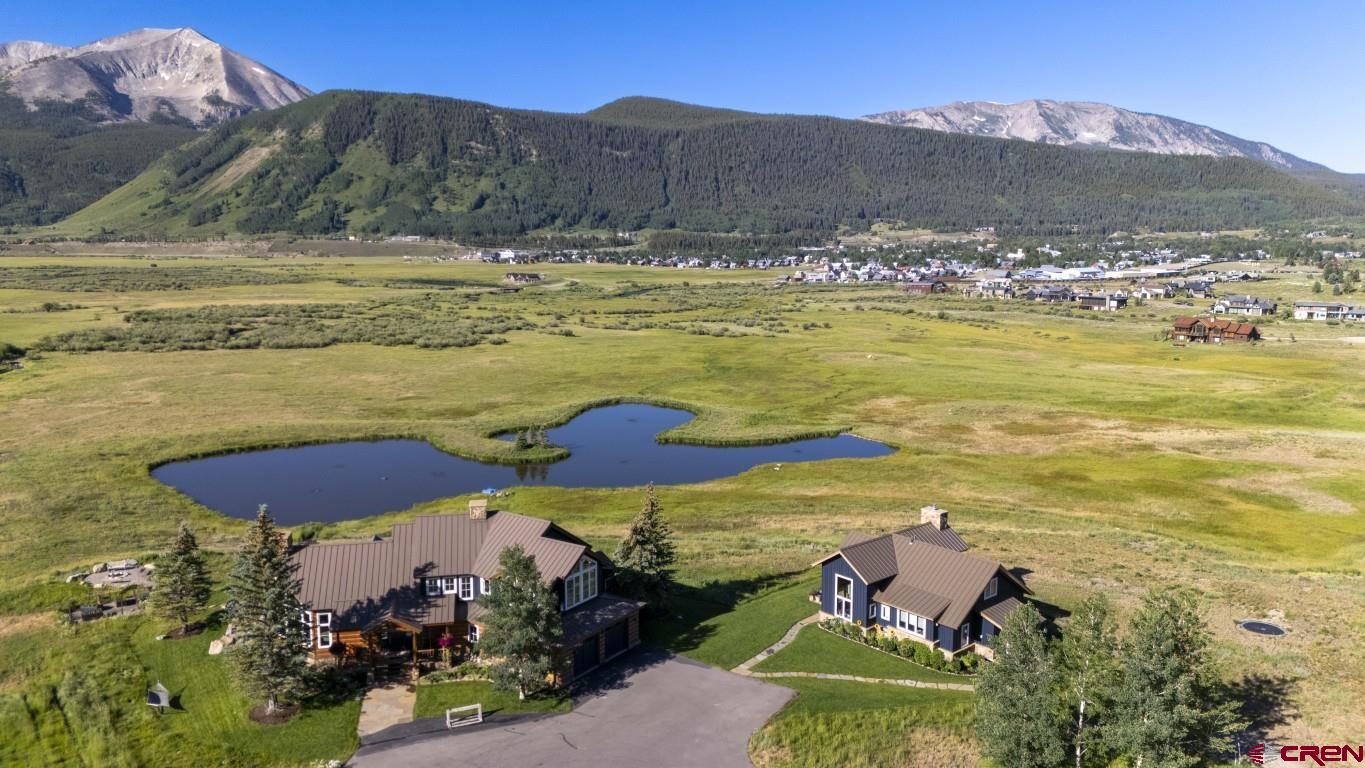 7 Moon Ridge Lane Crested Butte, CO 81224 - Photo 2 of 44 a view of a lake with a mountain